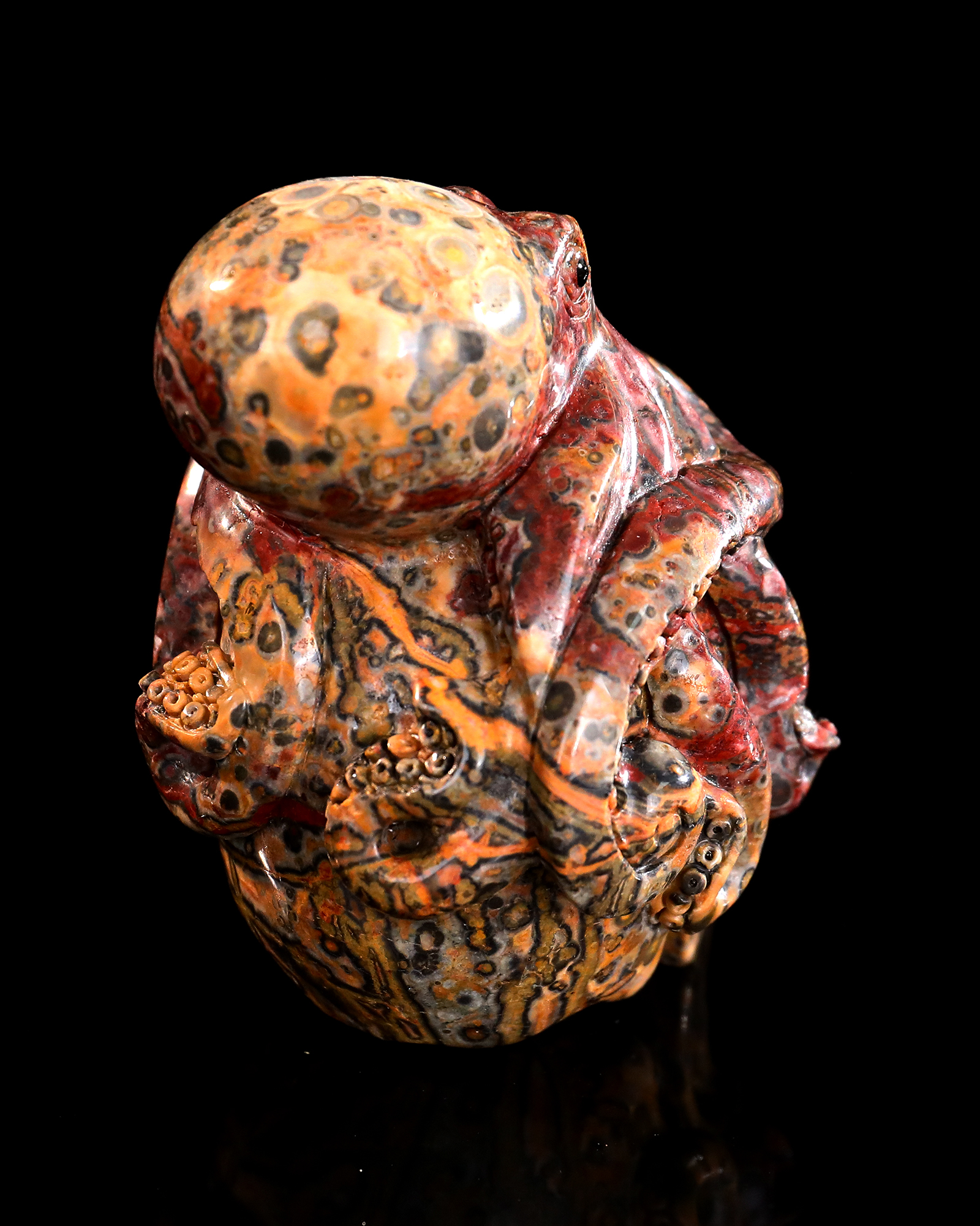 Red Leopard Skin Stone Skull Adorned with Hand-Carved Octopus Natural Gemstone Carving