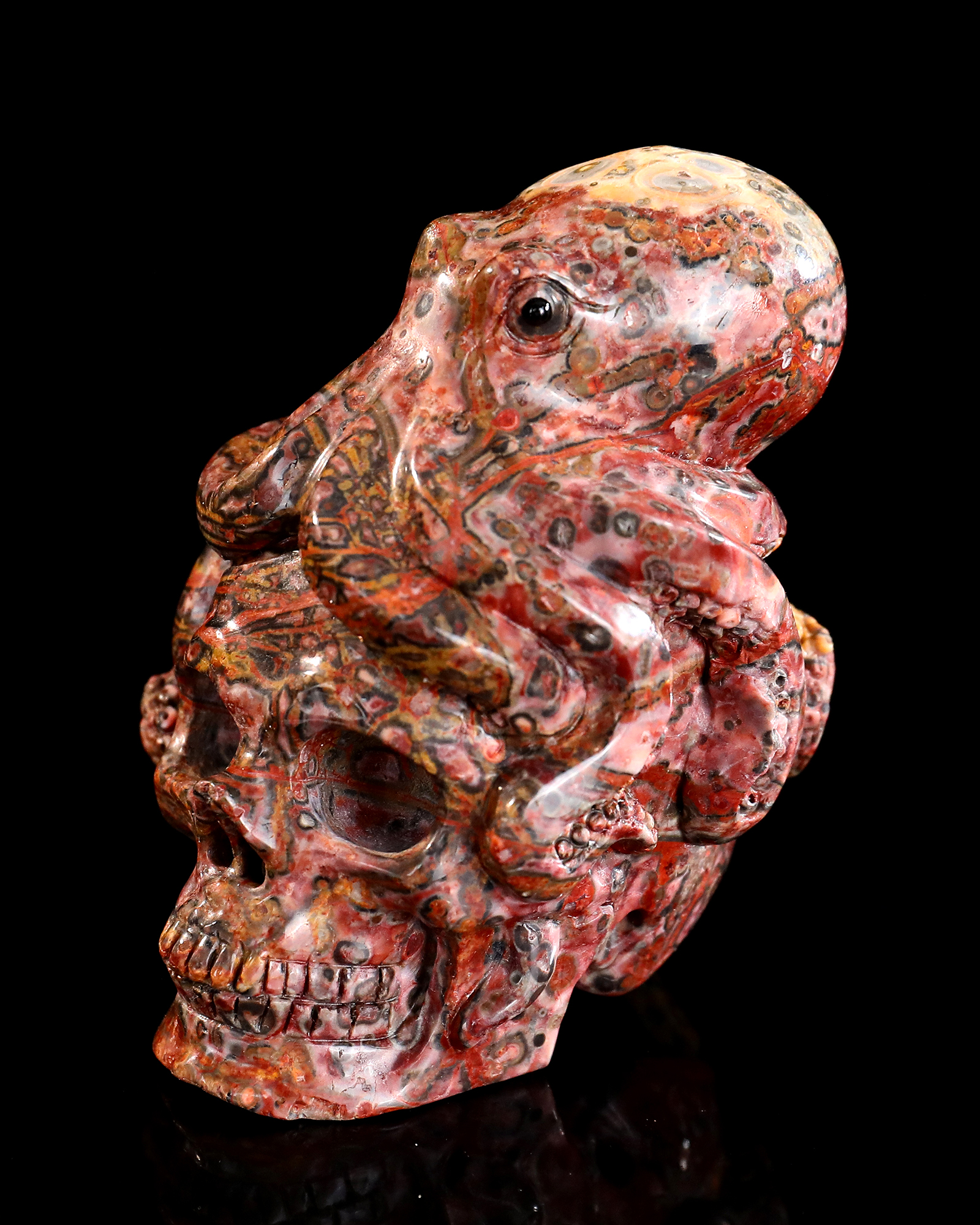 Red Leopard Skin Stone Skull Adorned with Hand-Carved Octopus Natural Gemstone Carving