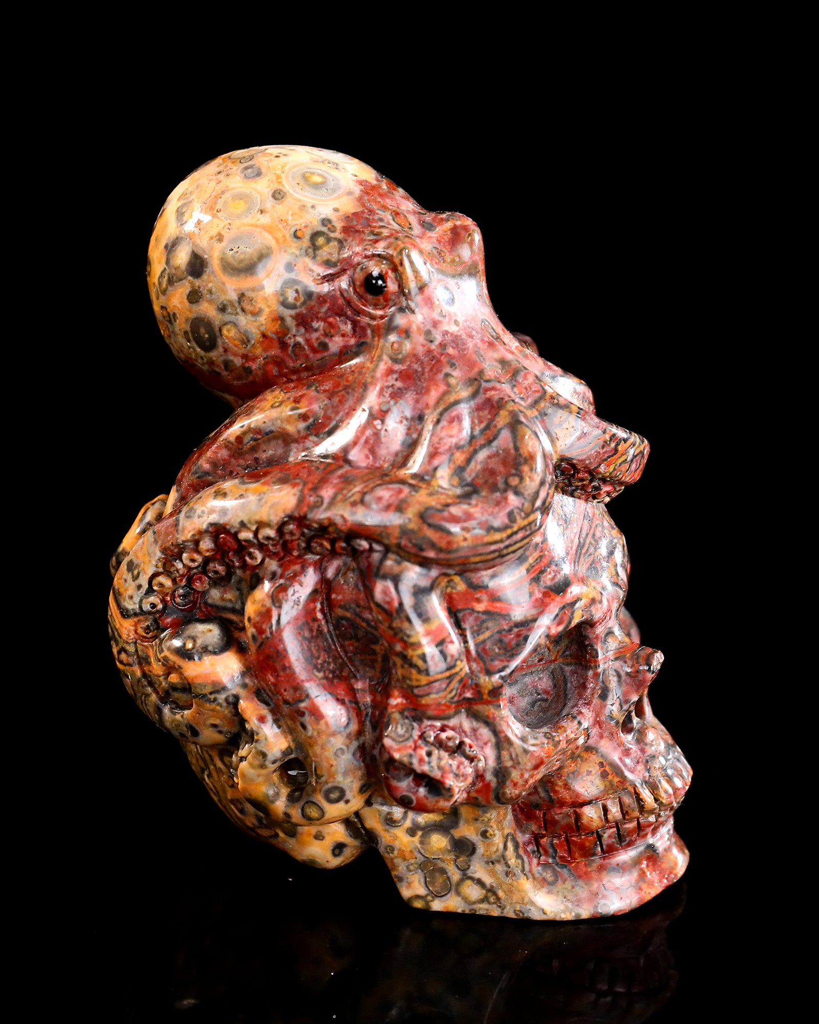 Red Leopard Skin Stone Skull Adorned with Hand-Carved Octopus Natural Gemstone Carving